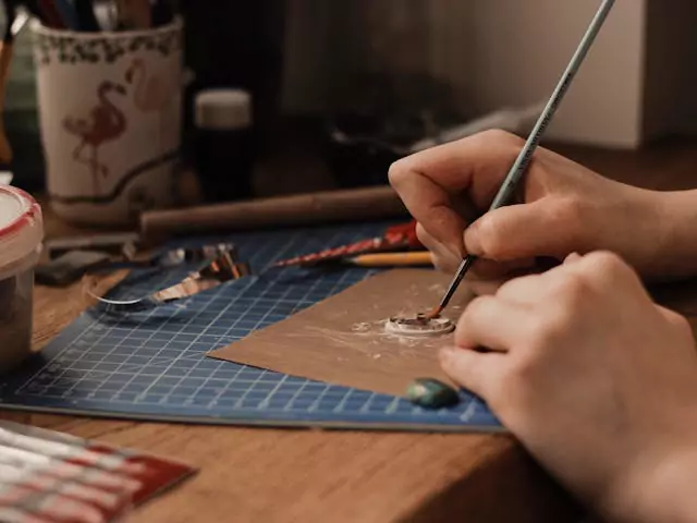 brushing a piece of jewelry