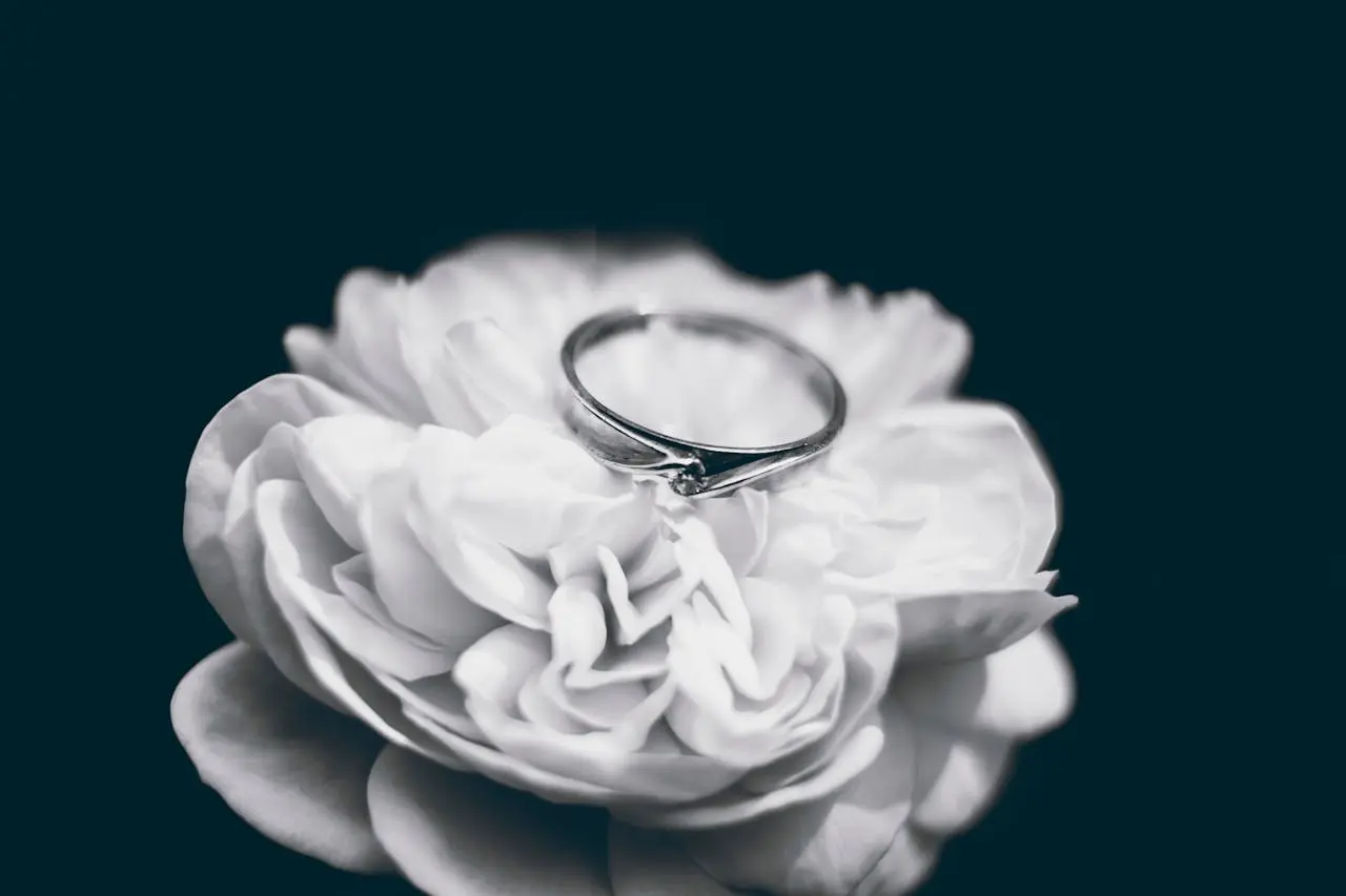 silver ring on white flower